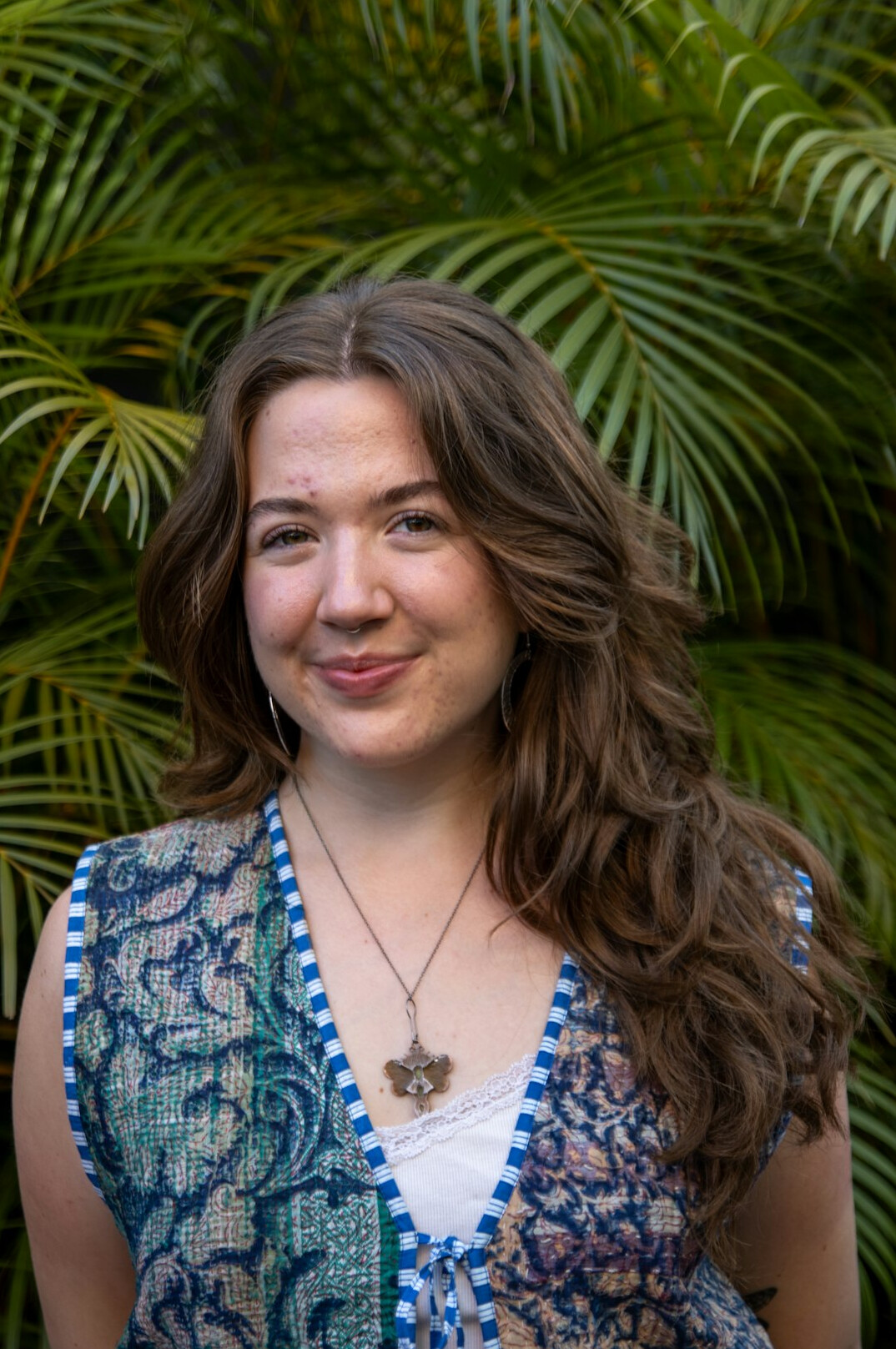 Portrait of a smiling woman with shoulder-length light brown hair