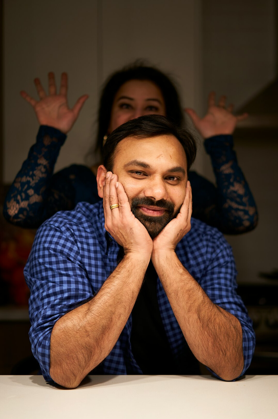 Portrait of a smiling man with short dark hair and a beard